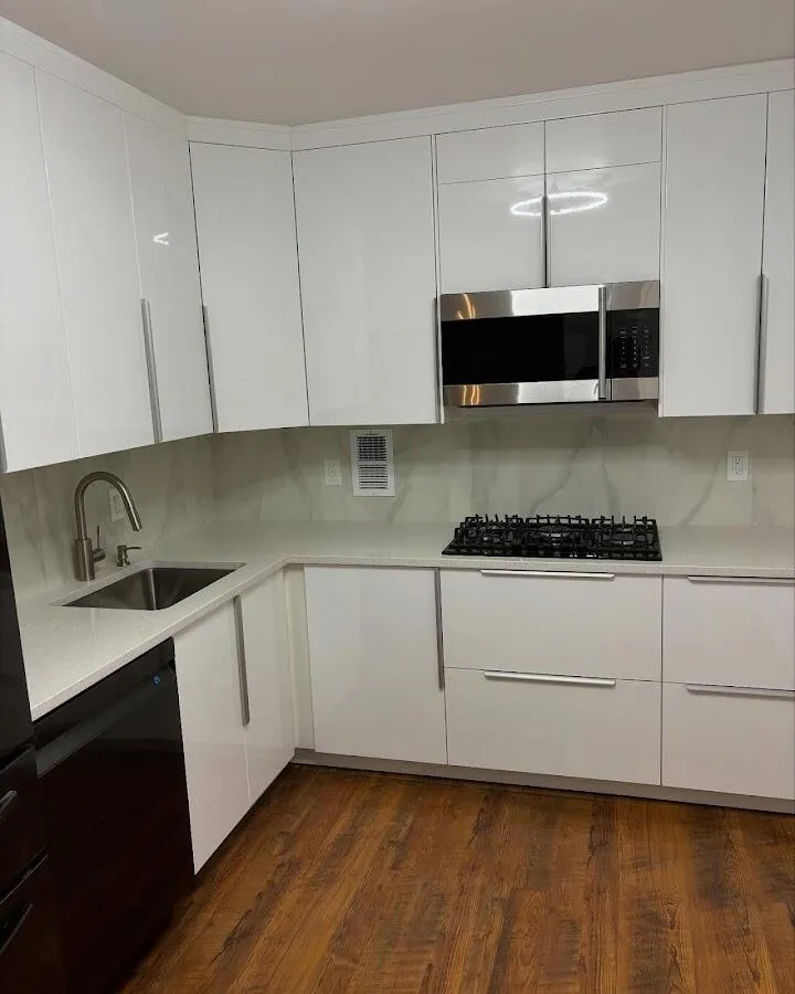 Restored kitchen with white cabinets after water damage in Corona